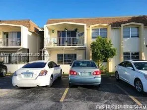 a view of a car parked in front of a house