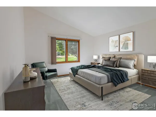 a spacious bedroom with a bed and window