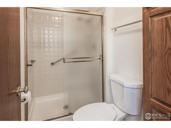 a bathroom with a shower and a toilet