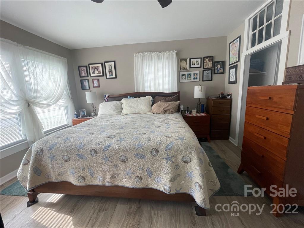 170 South Mitchell Avenue Rutherfordton, NC 28139 - Photo 13 of 21 a bedroom with a bed and wooden floor