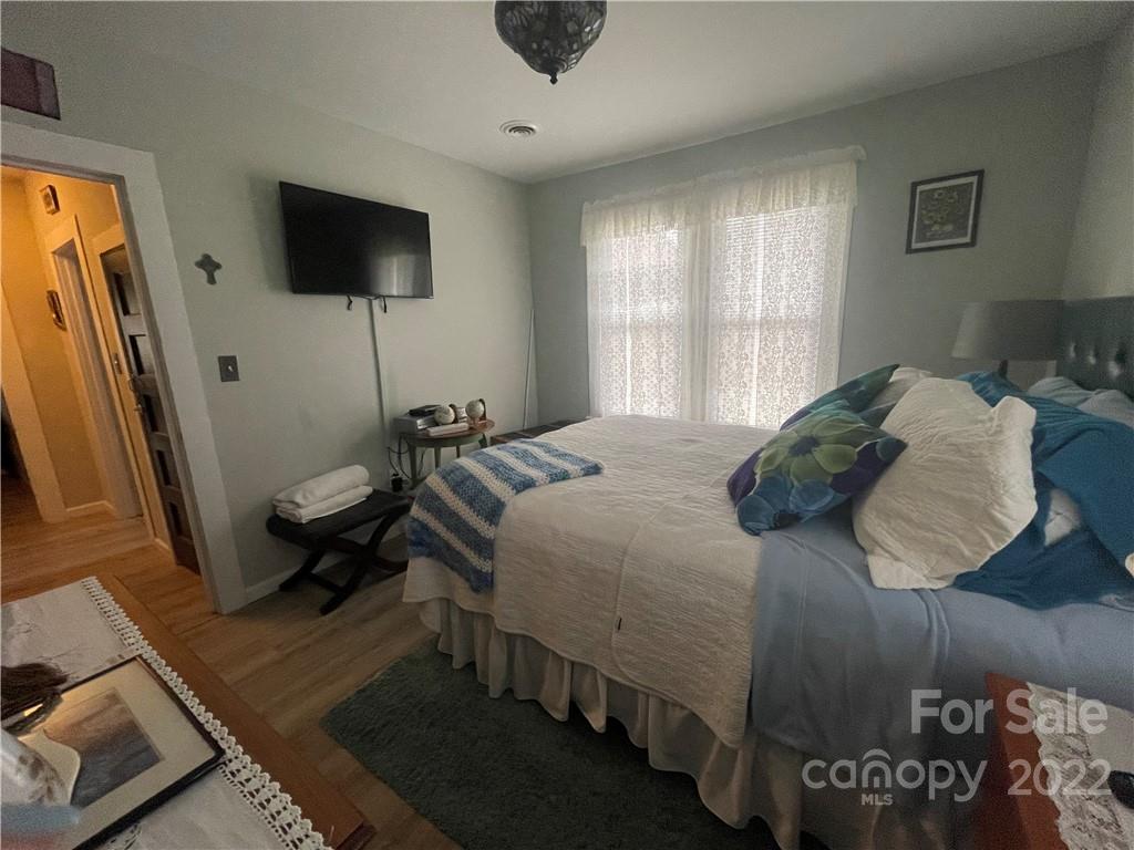 170 South Mitchell Avenue Rutherfordton, NC 28139 - Photo 7 of 21 a bedroom with a bed and a flat screen tv