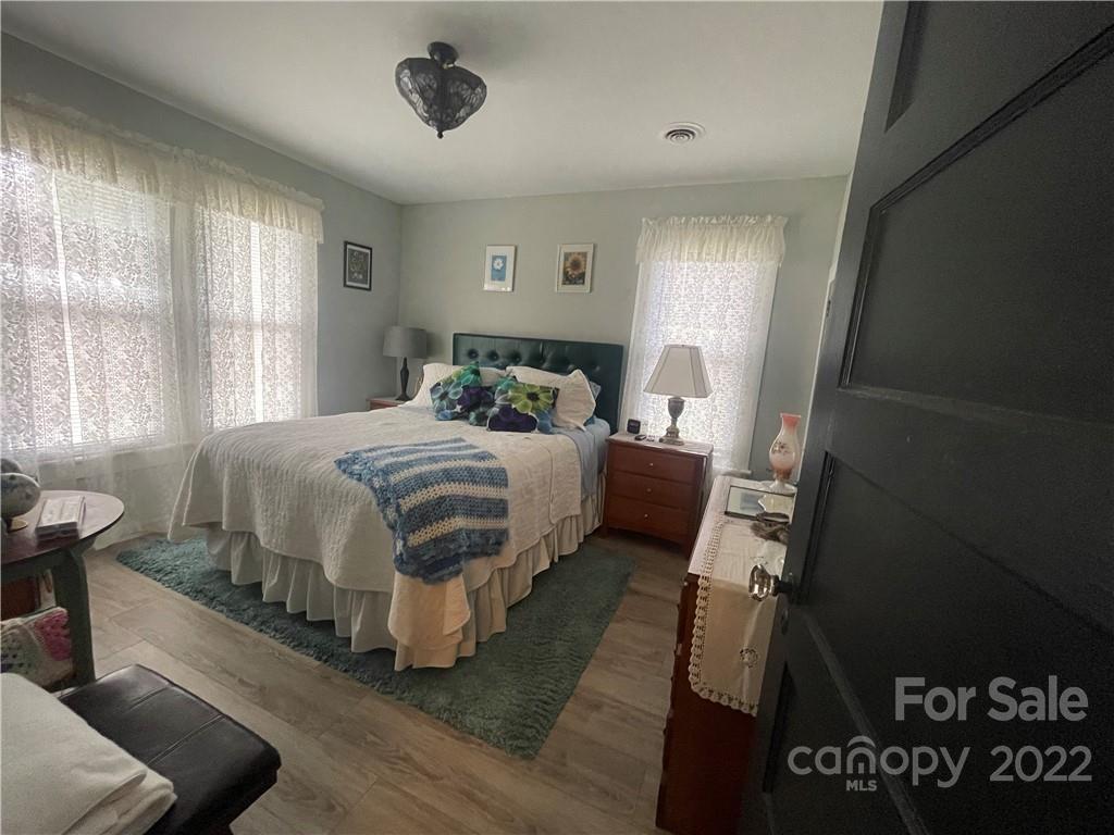 170 South Mitchell Avenue Rutherfordton, NC 28139 - Photo 8 of 21 a bedroom with a bed and wooden floor