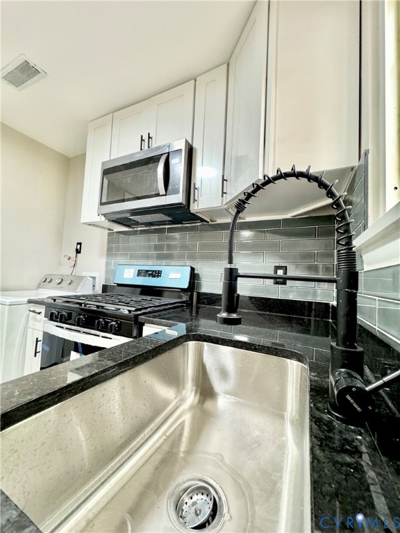 403 Roxana Road Henrico, VA 23075 - Photo 6 of 42 Stainless steel sink with a black pull-down faucet