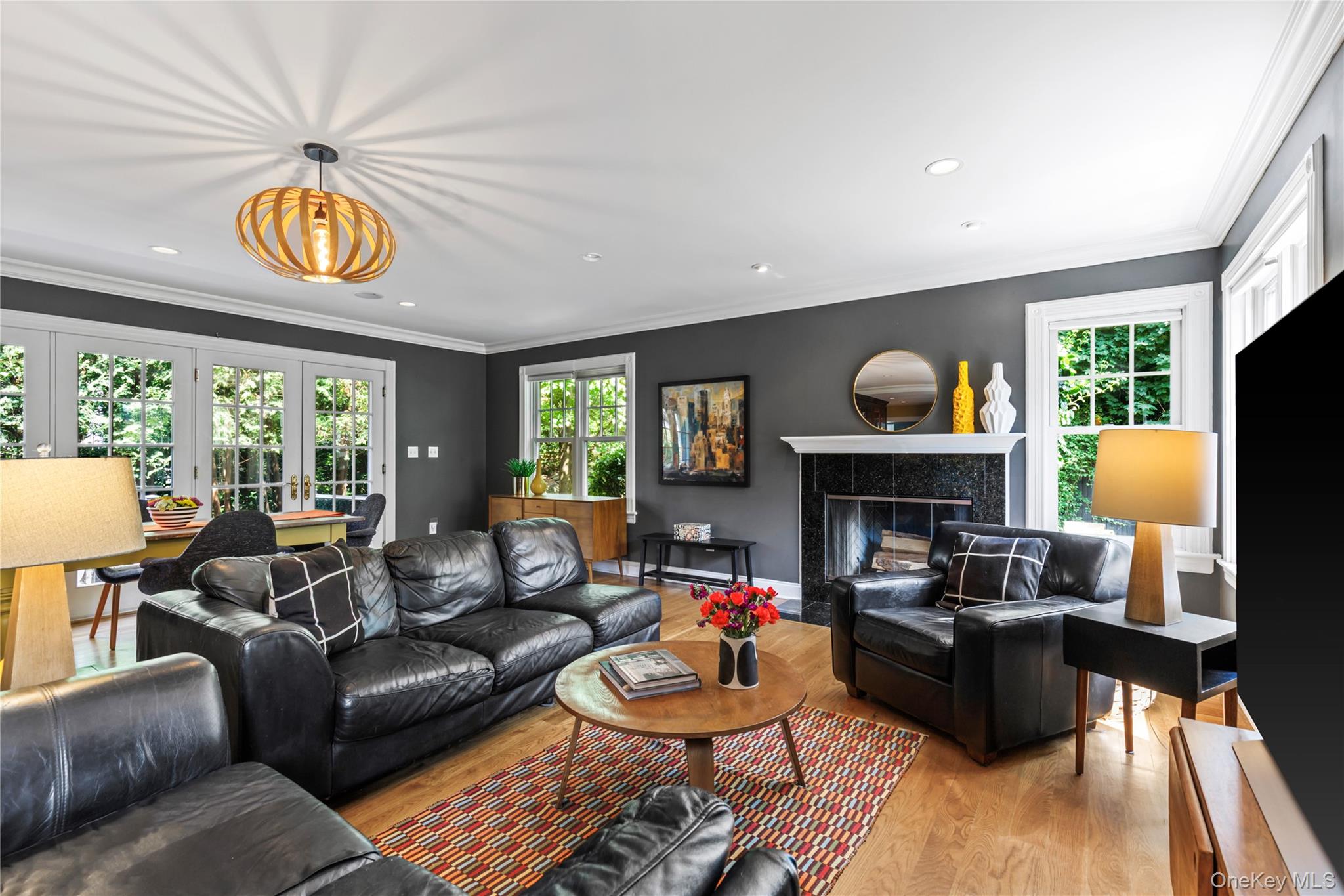12 Kenmare Road Larchmont, NY 10538 - Photo 11 of 36 The second fireplace anchors the back of the great room and its glow is visible from all vantage points.