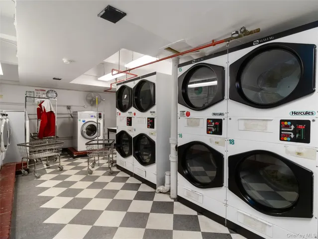 a view of a patio with table and chairs with wooden fence and plants
