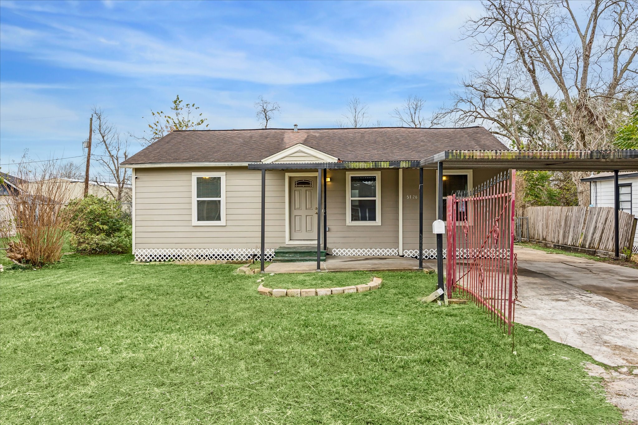 5126 Higgins Street Houston, TX 77033 - Photo 1 of 14 a backyard of a house with table and chairs
