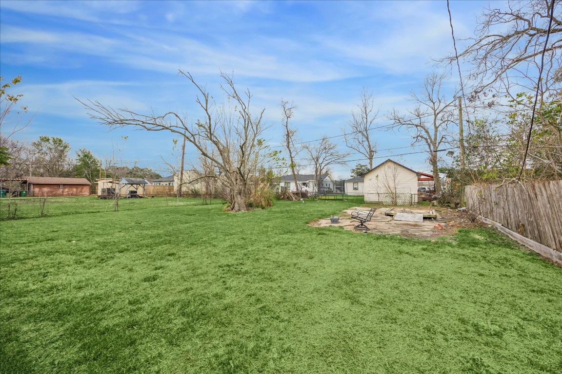5126 Higgins Street Houston, TX 77033 - Photo 14 of 14 a view of yard with swimming pool and green space