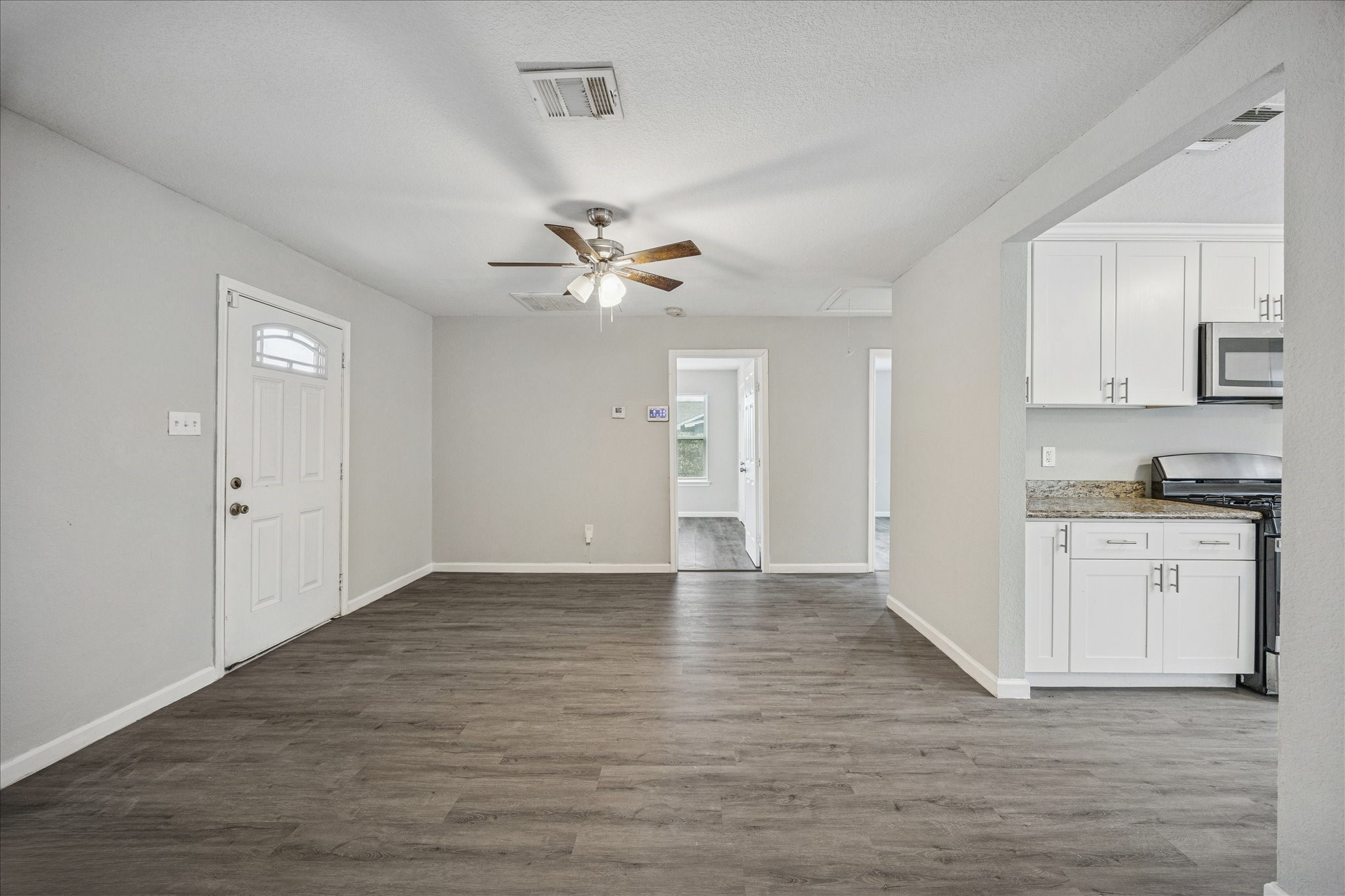 5126 Higgins Street Houston, TX 77033 - Photo 2 of 14 a view of an empty room with kitchen and sink