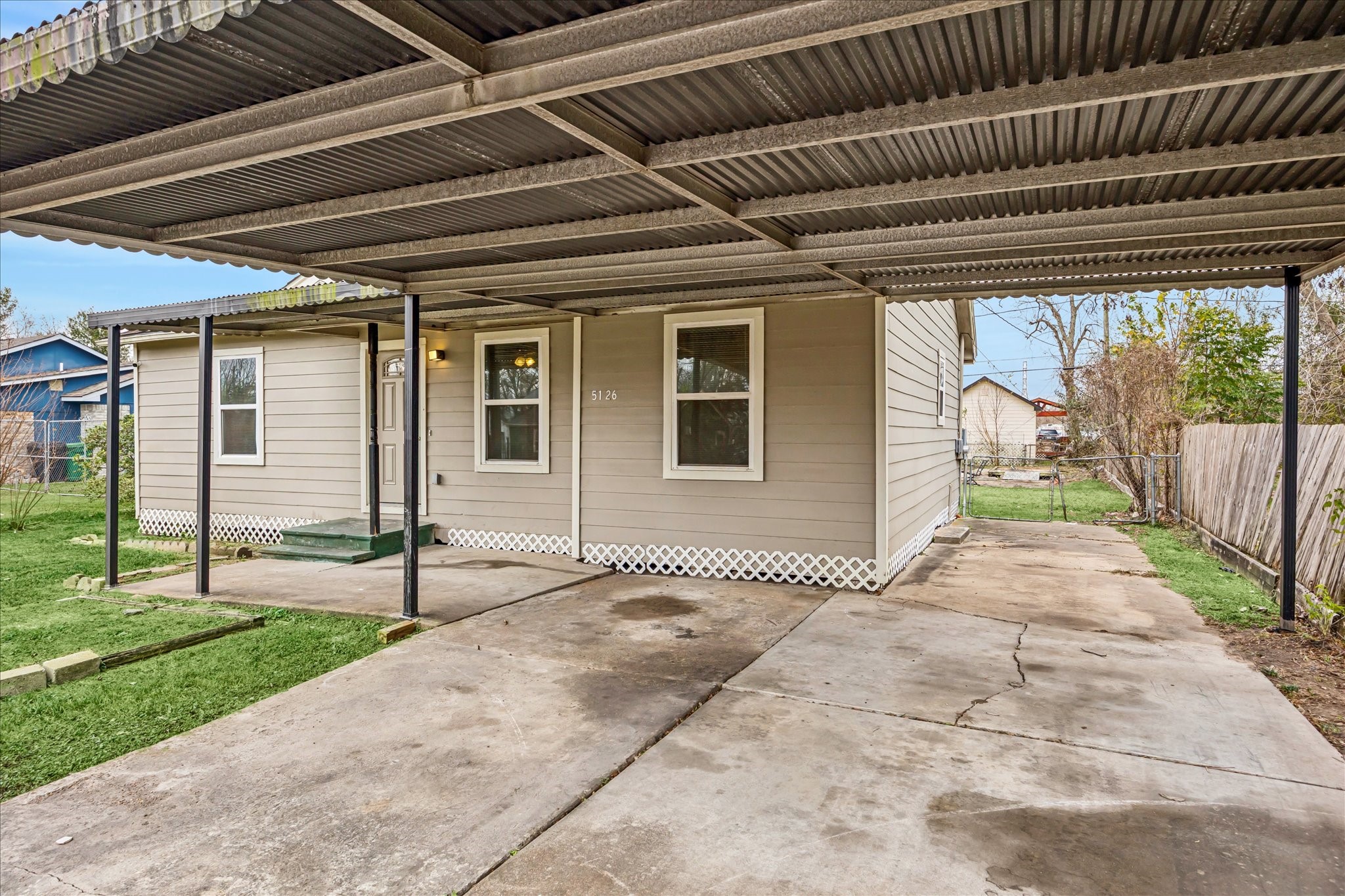 5126 Higgins Street Houston, TX 77033 - Photo 6 of 14 a front view of a house with a garden