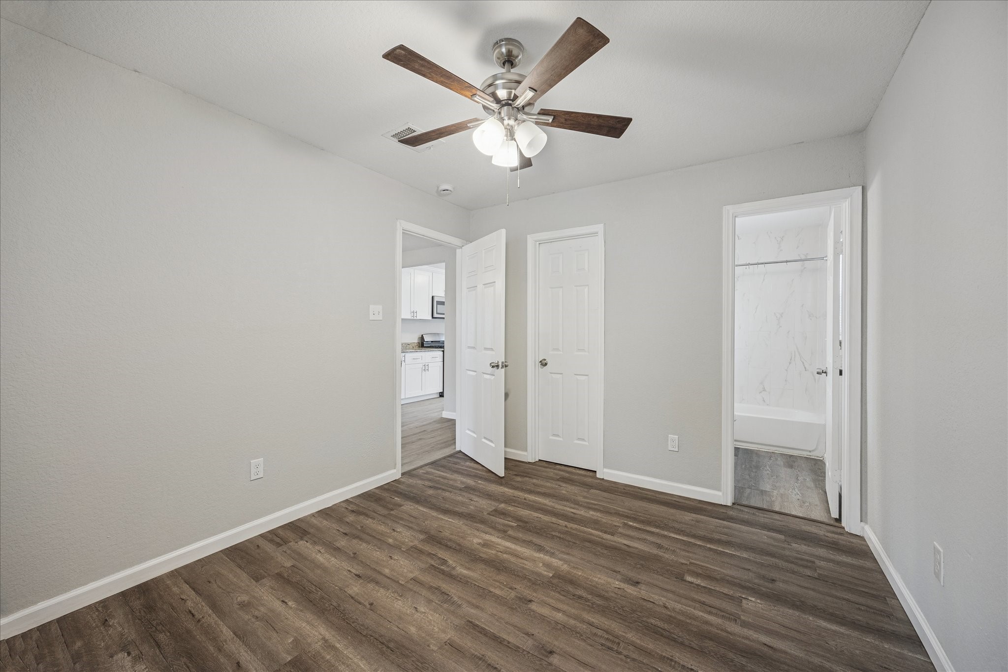 5126 Higgins Street Houston, TX 77033 - Photo 9 of 14 wooden floor in an empty room