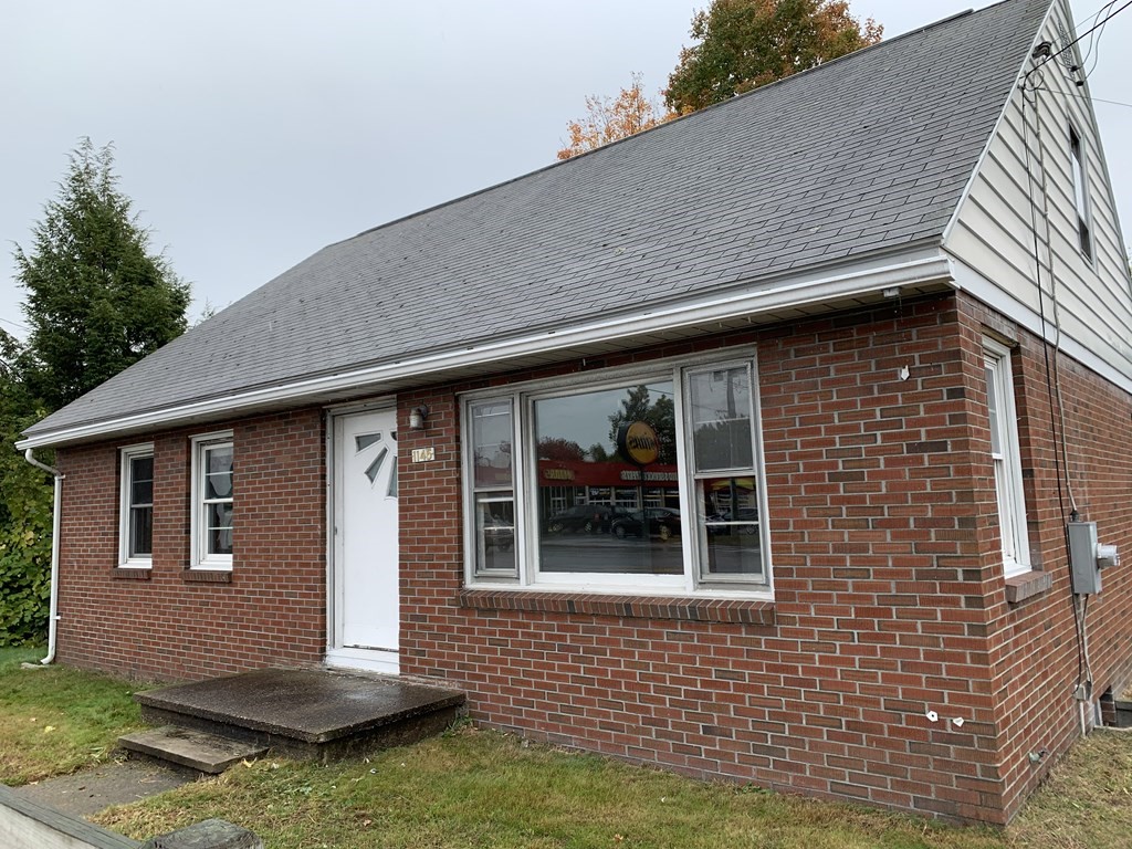1145 Boston Road Springfield, MA 01119 - Photo 3 of 19 a front view of a house with a yard