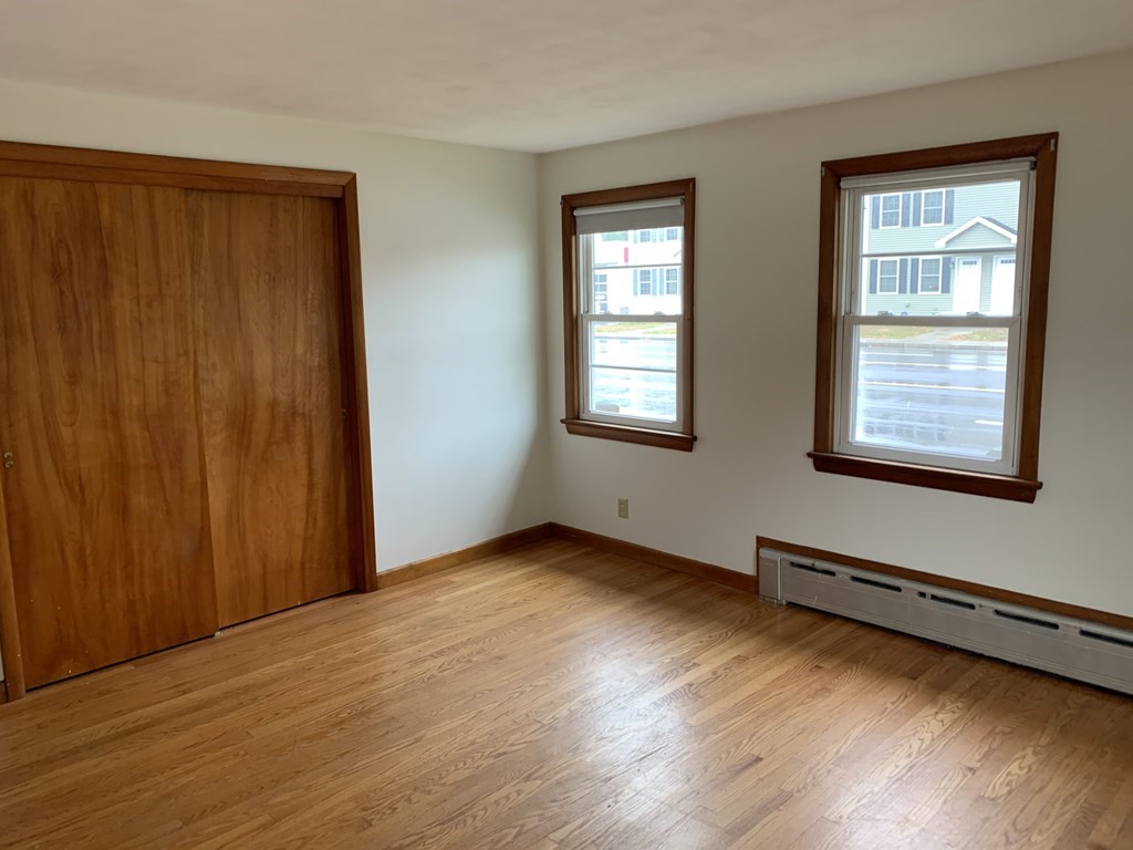 1145 Boston Road Springfield, MA 01119 - Photo 10 of 19 an empty room with wooden floor and windows
