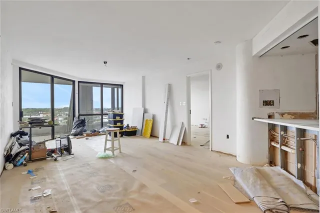 a view of a livingroom with furniture and a window