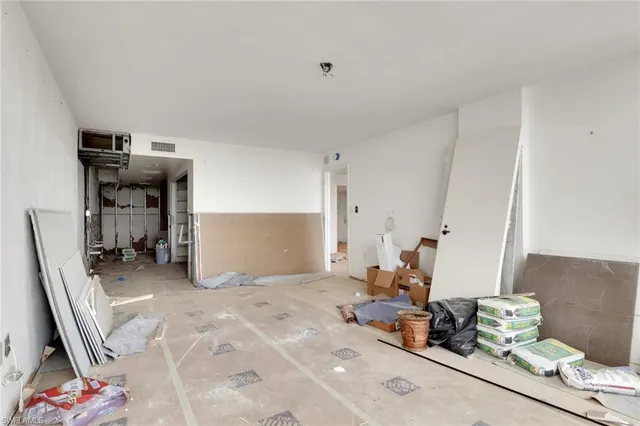 a room with furniture and gym equipment