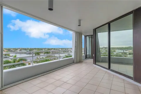 a view of an empty room with a large window