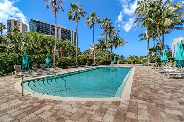 a view of a swimming pool with a patio