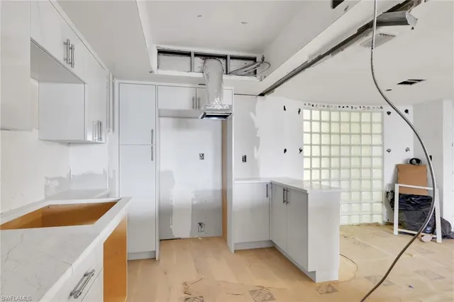 a bathroom with a tub a sink and a shower