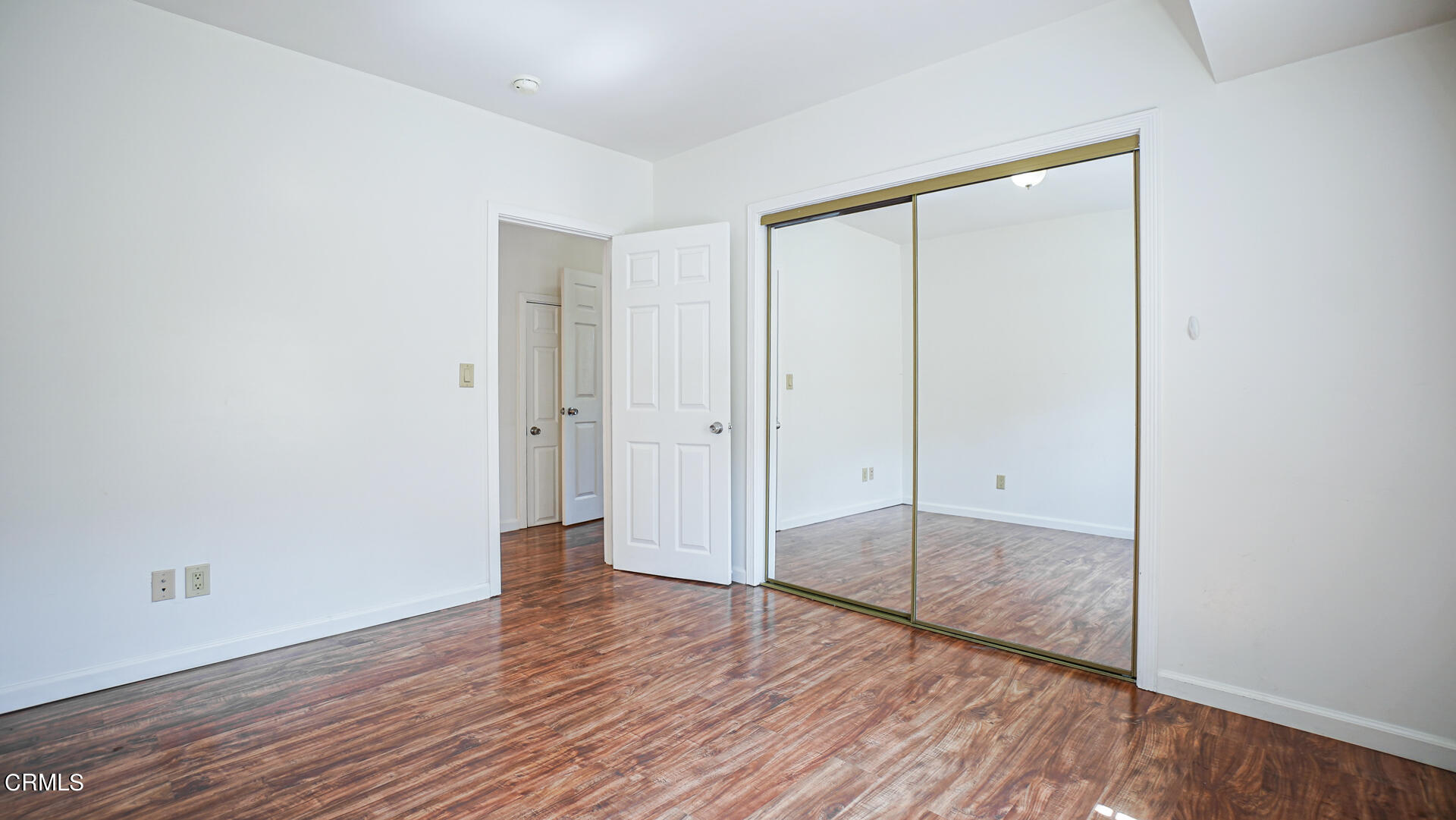 3821 Elma Road Pasadena, CA 91107 - Photo 14 of 27 an empty room with wooden floor and sliding door