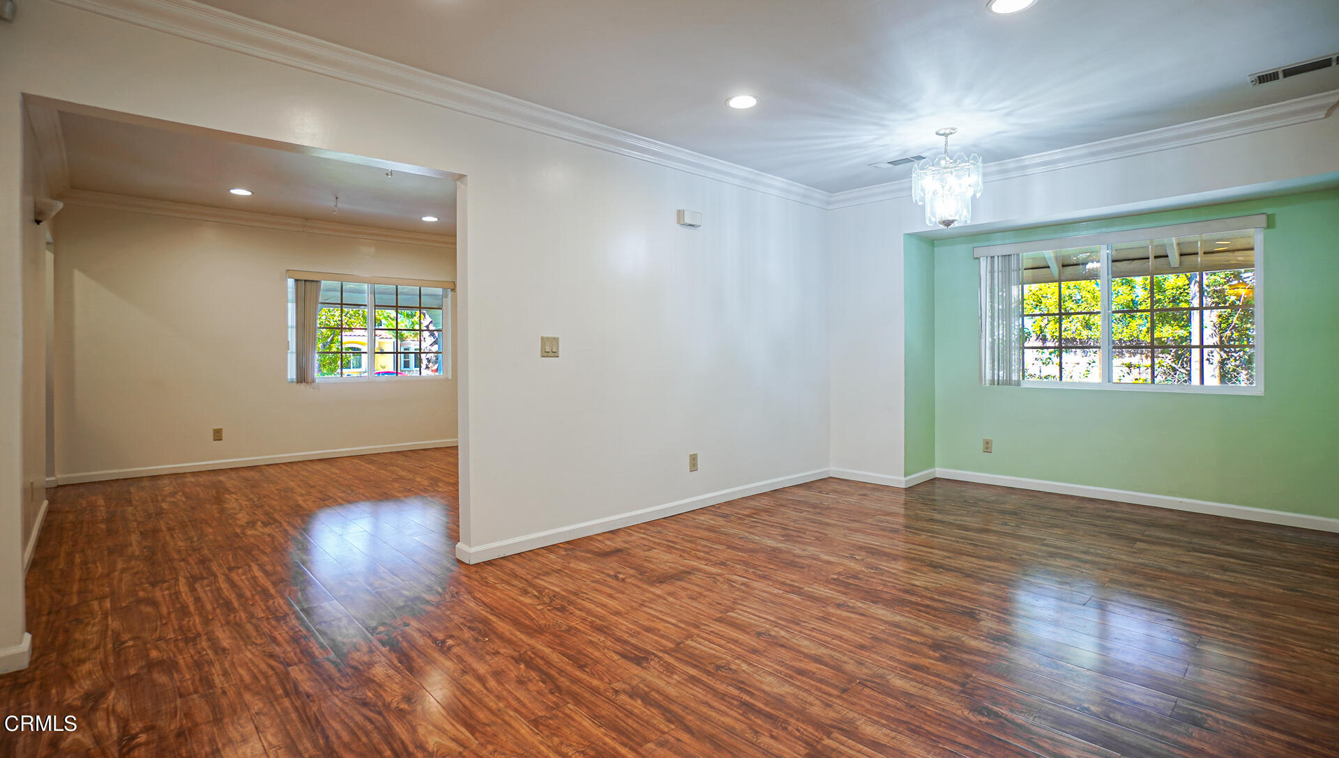 3821 Elma Road Pasadena, CA 91107 - Photo 5 of 27 an empty room with wooden floor and windows