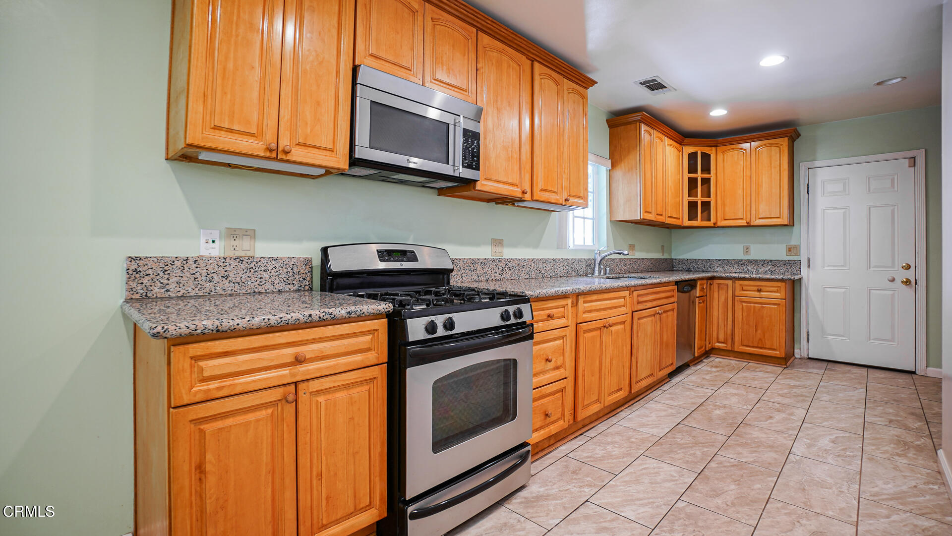 3821 Elma Road Pasadena, CA 91107 - Photo 8 of 27 a kitchen with stainless steel appliances granite countertop a stove and a sink