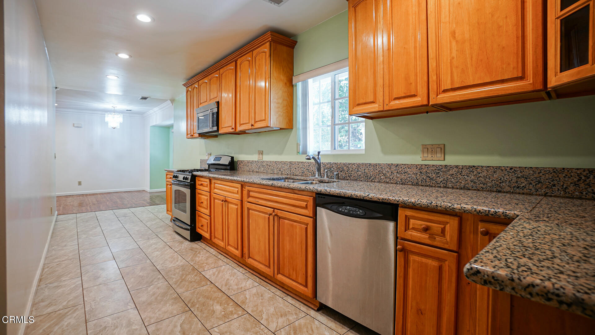 3821 Elma Road Pasadena, CA 91107 - Photo 9 of 27 a kitchen with stainless steel appliances granite countertop a sink stove and cabinets