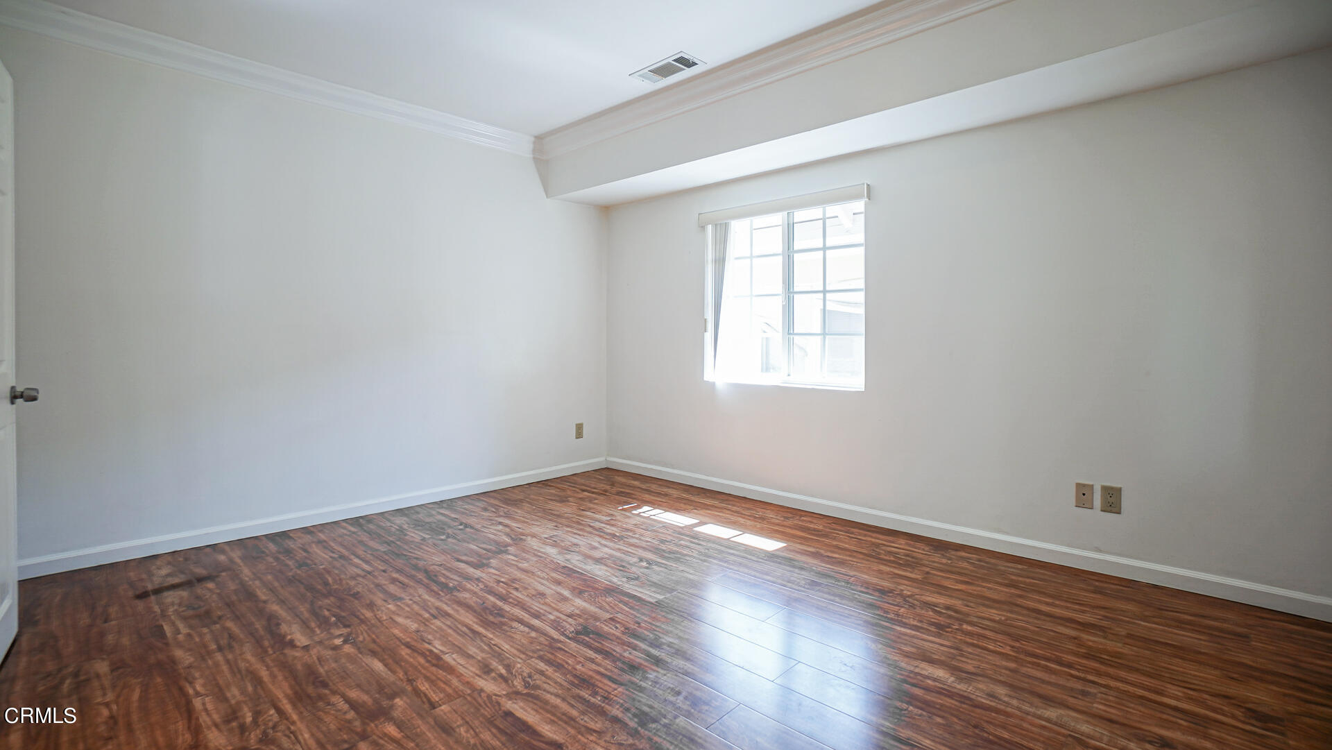 3821 Elma Road Pasadena, CA 91107 - Photo 10 of 27 an empty room with wooden floor and windows