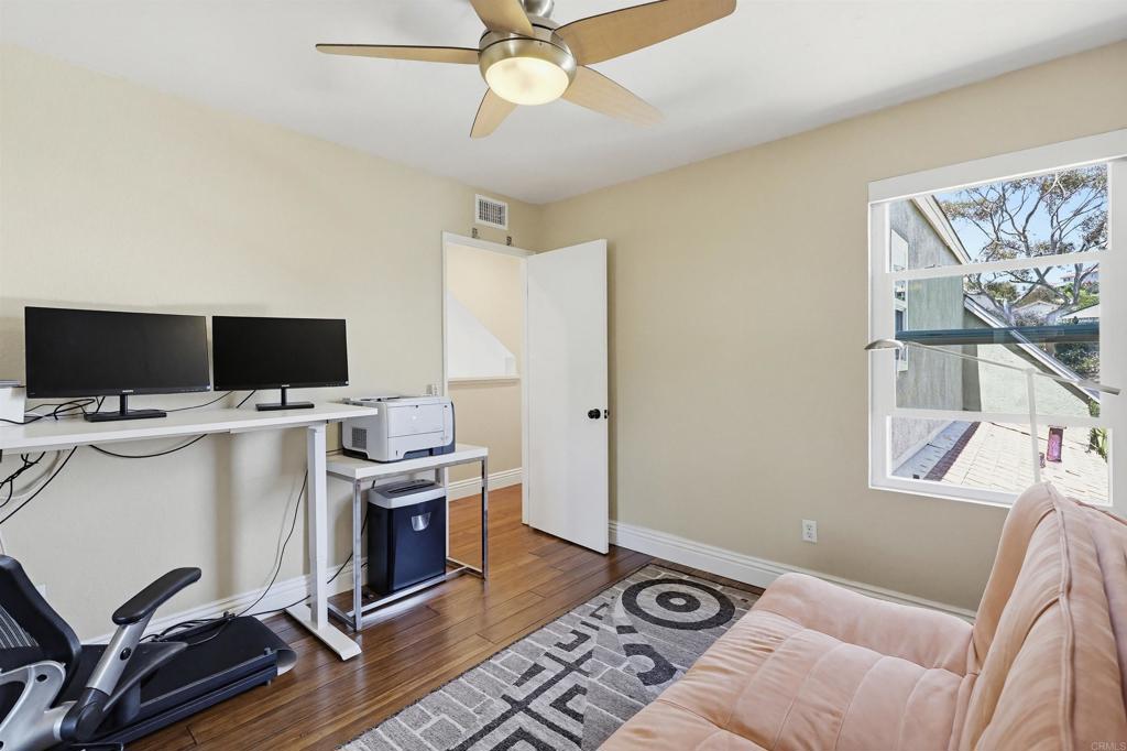2756 Southampton Road Carlsbad, CA 92010 - Photo 37 of 40 a view of a workspace with furniture and a flat screen tv