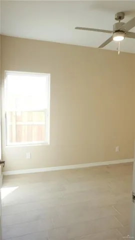 a white toilet and tub sitting next to a bathroom sink