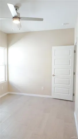 a view of a bathroom with mirror