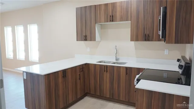 a bathroom with a sink a mirror and a shower