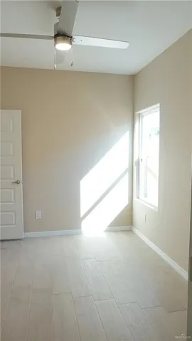 a view of an empty room with a window