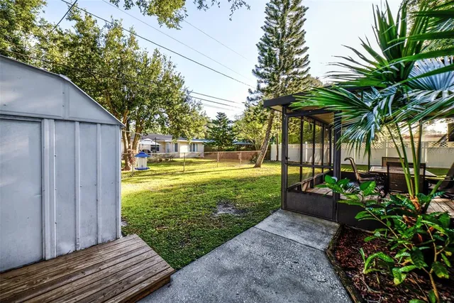 a view of a house with backyard space and balcony
