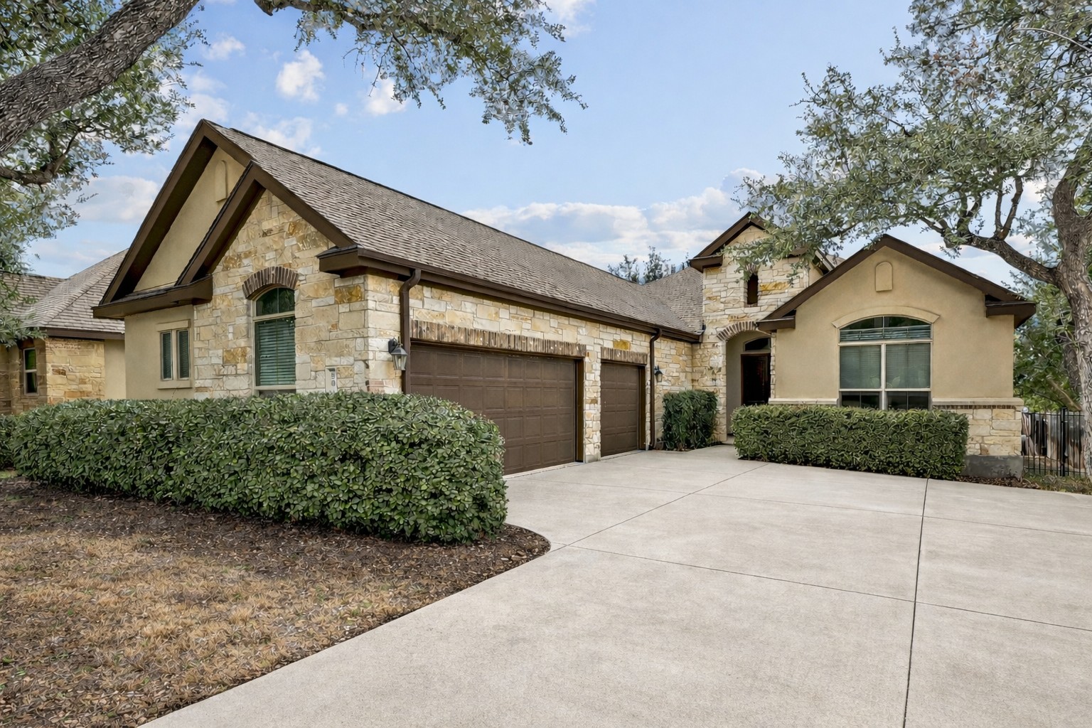 This single-story home features a side-facing 3-car garage complete with epoxy floors! **Photo has been AI enhanced to show true potential once driveway is power washed**