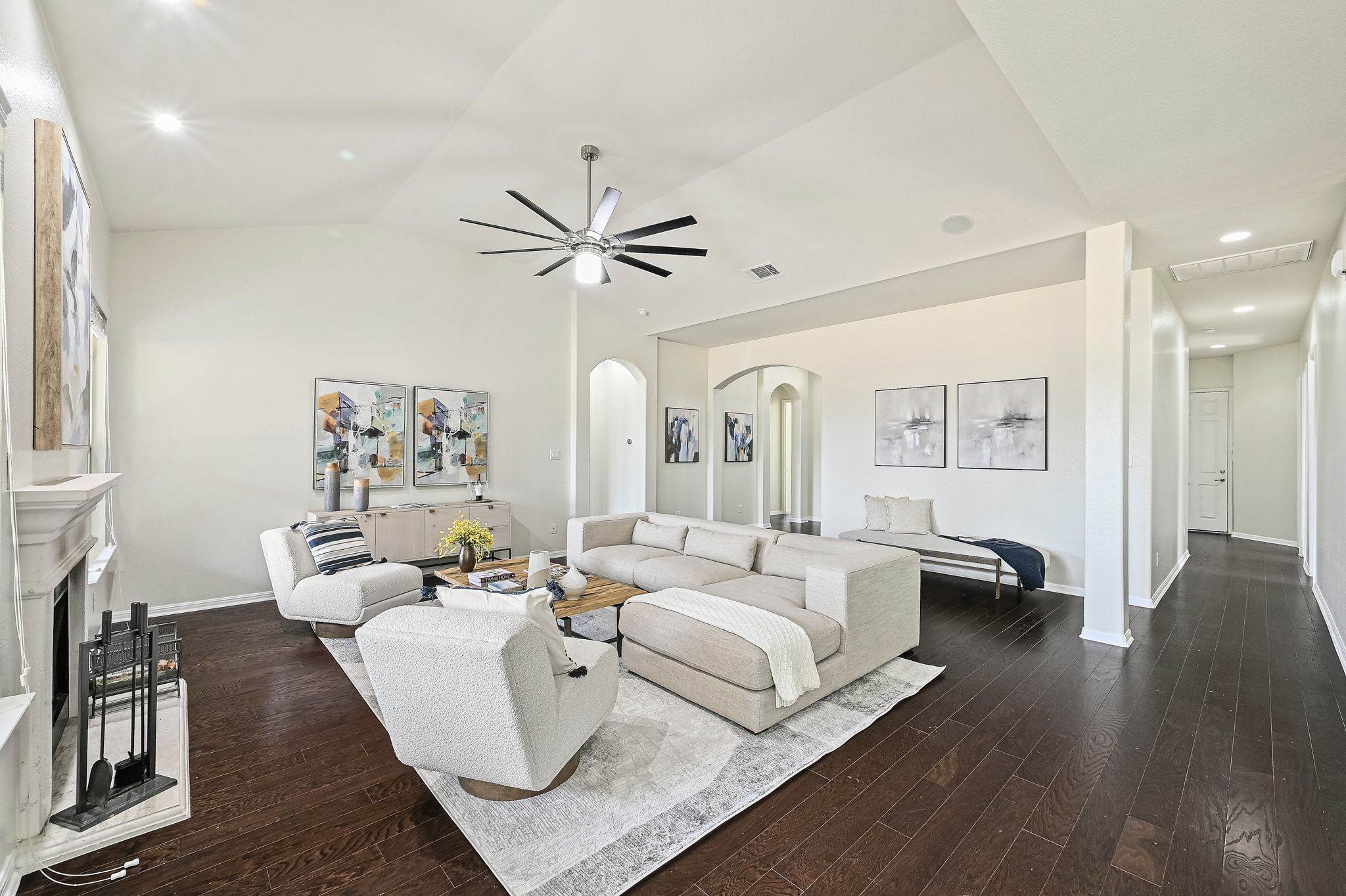 803 Wilson Ranch Place Cedar Park, TX 78613 - Photo 13 of 32 Rich wood flooring carries throughout the common areas, anchoring the light and airy design.
