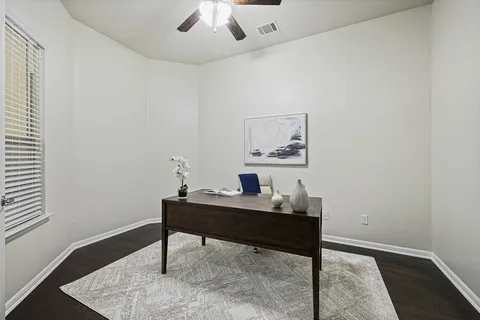 a workspace with furniture and window