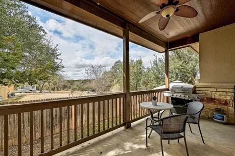a view of a balcony with furniture