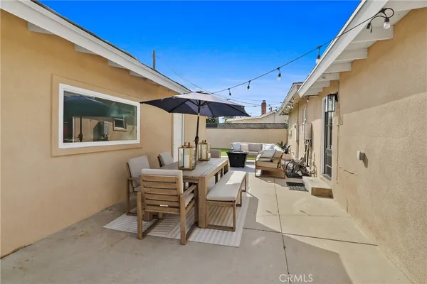a view of a chairs and tables in patio