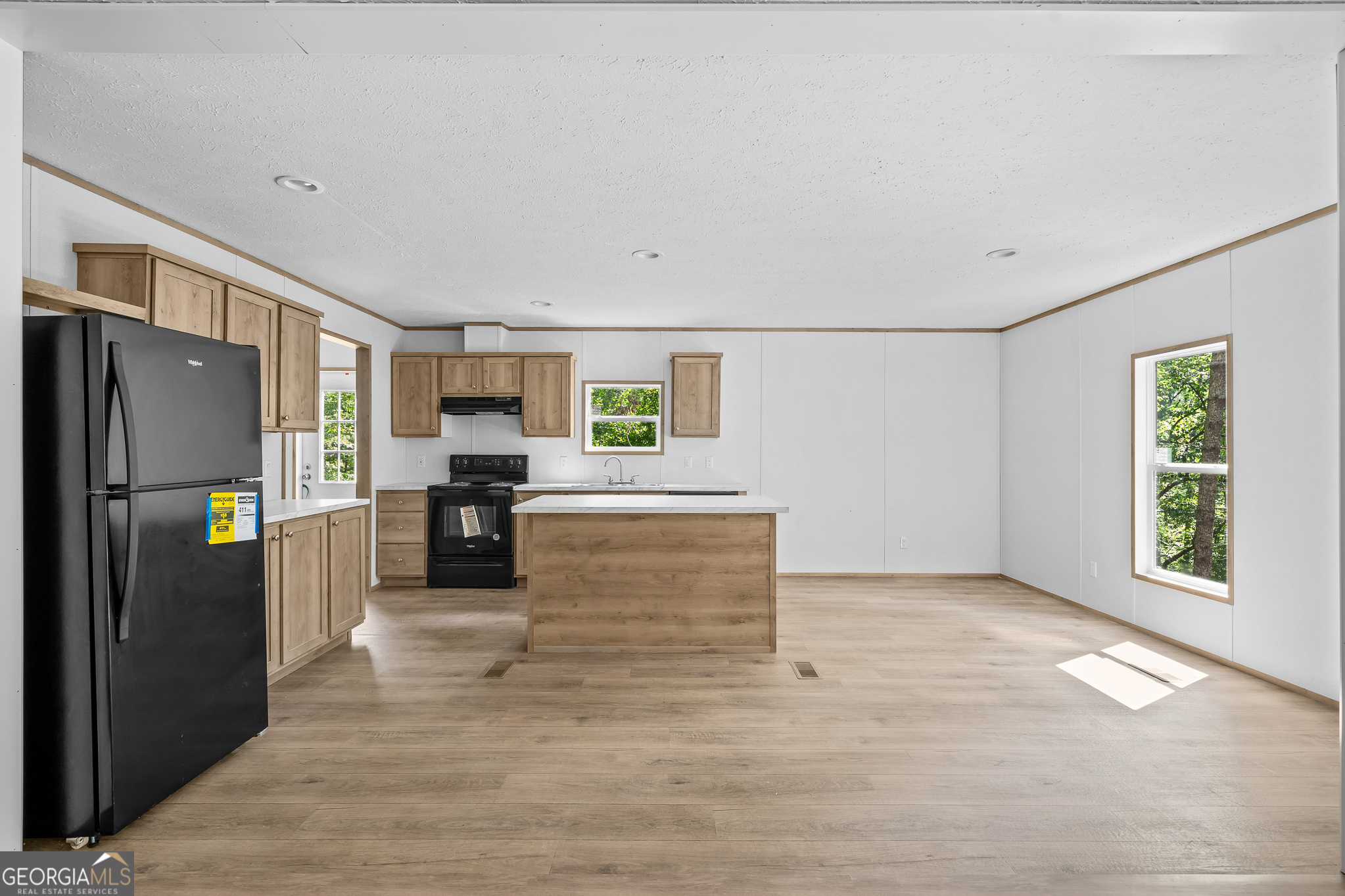 134 Double Line Road Ellijay, GA 30540 - Photo 13 of 33 a view of kitchen with stainless steel appliances kitchen island wooden cabinets and refrigerator