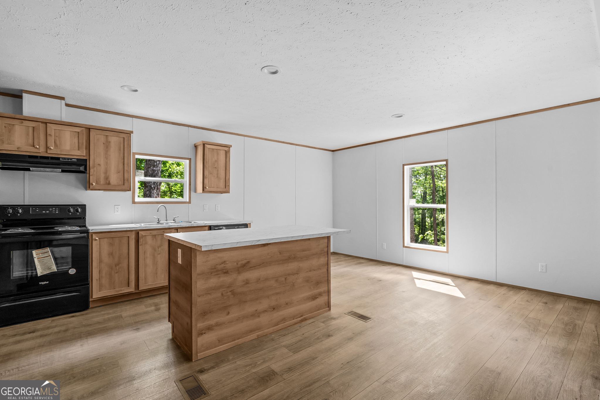 134 Double Line Road Ellijay, GA 30540 - Photo 14 of 33 a kitchen with granite countertop a stove and a sink