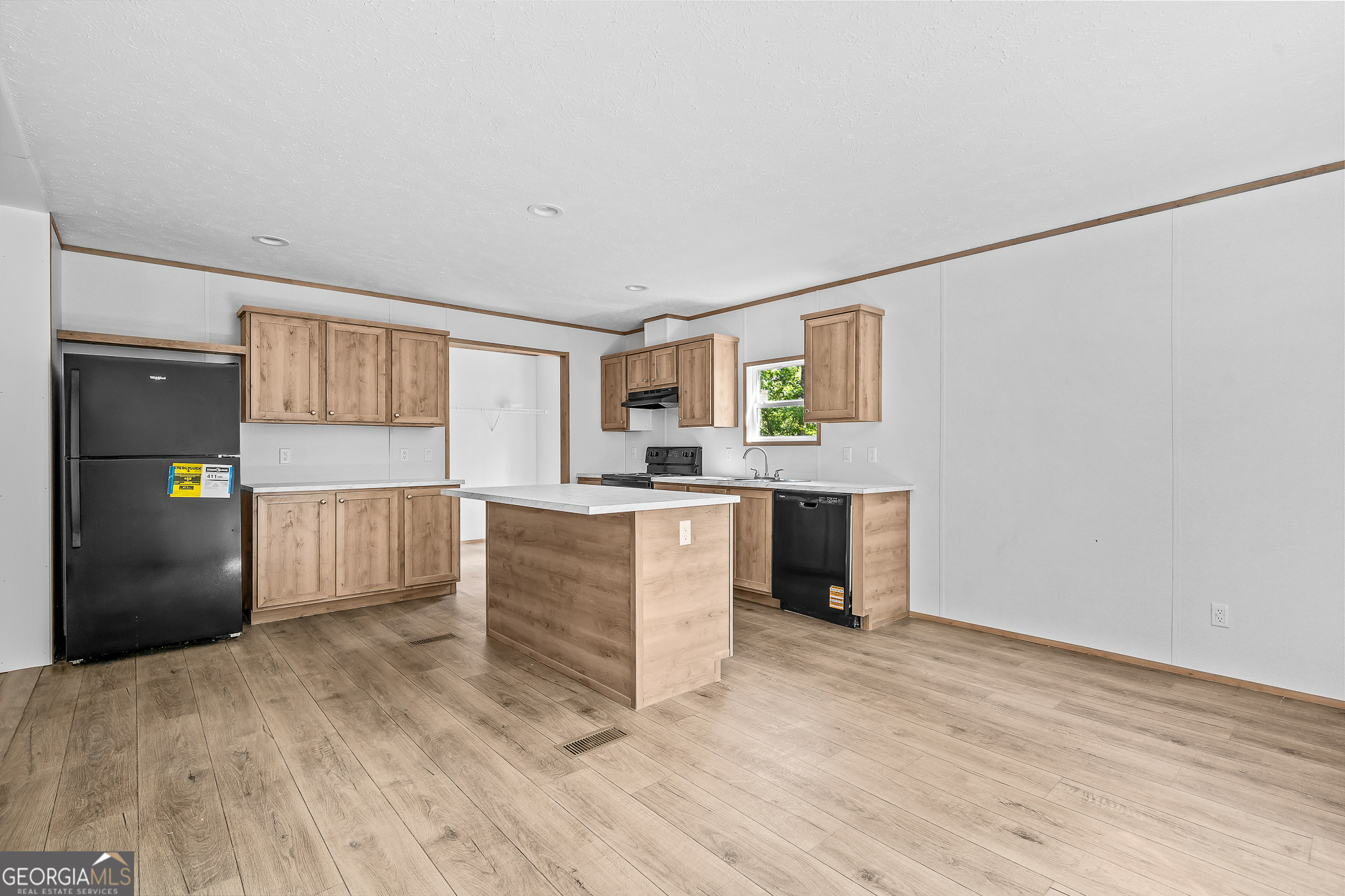 134 Double Line Road Ellijay, GA 30540 - Photo 15 of 33 a kitchen with granite countertop a refrigerator and a stove top oven