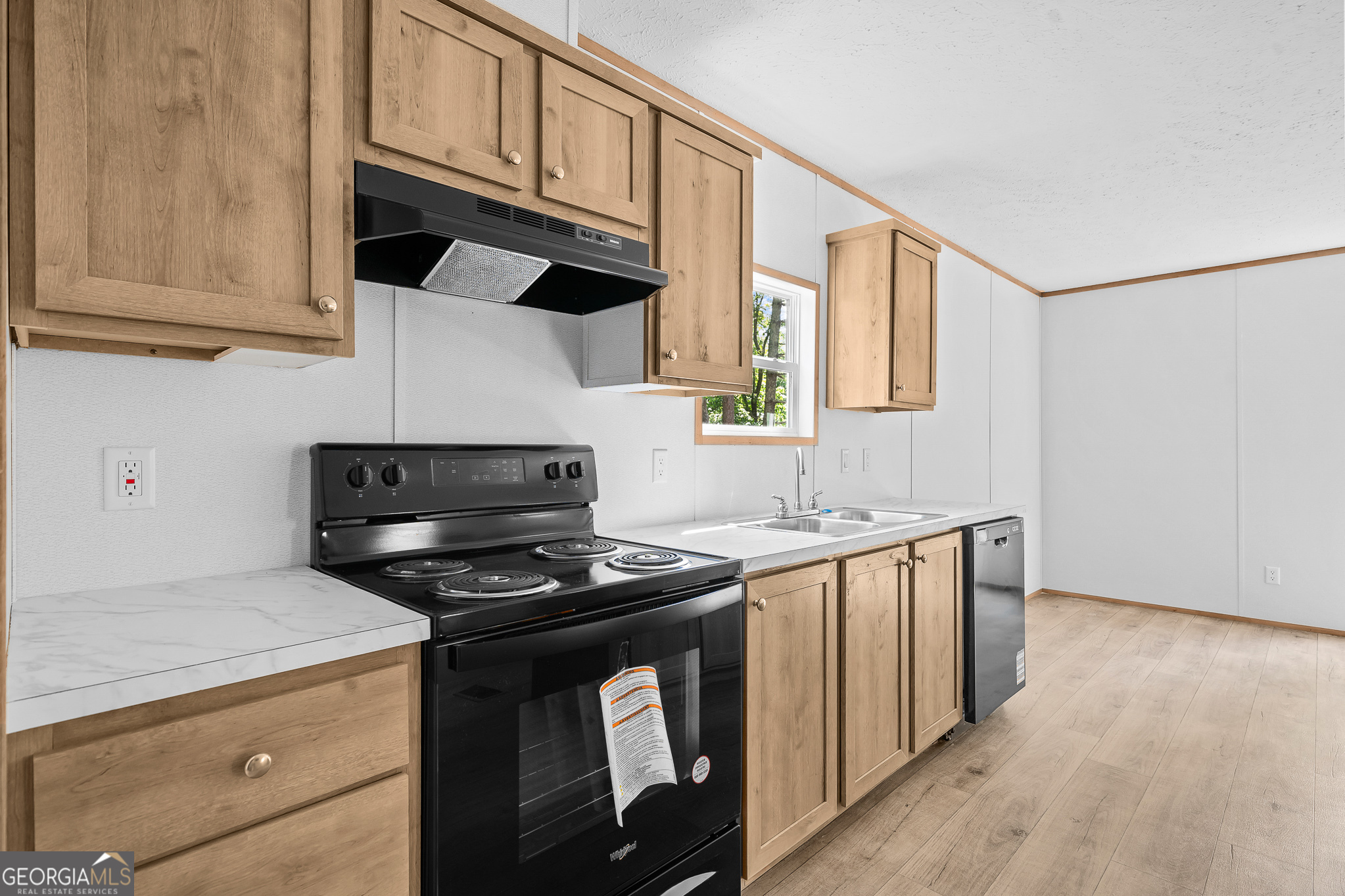 134 Double Line Road Ellijay, GA 30540 - Photo 17 of 33 a kitchen with stainless steel appliances a stove a sink and a microwave