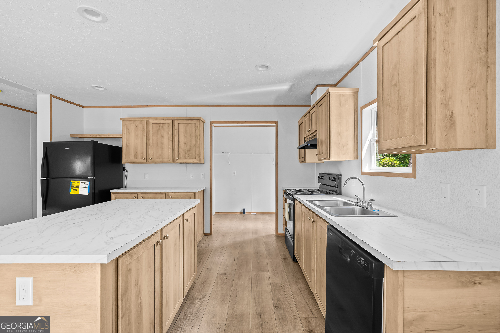 134 Double Line Road Ellijay, GA 30540 - Photo 18 of 33 a kitchen with a stove a sink and a refrigerator