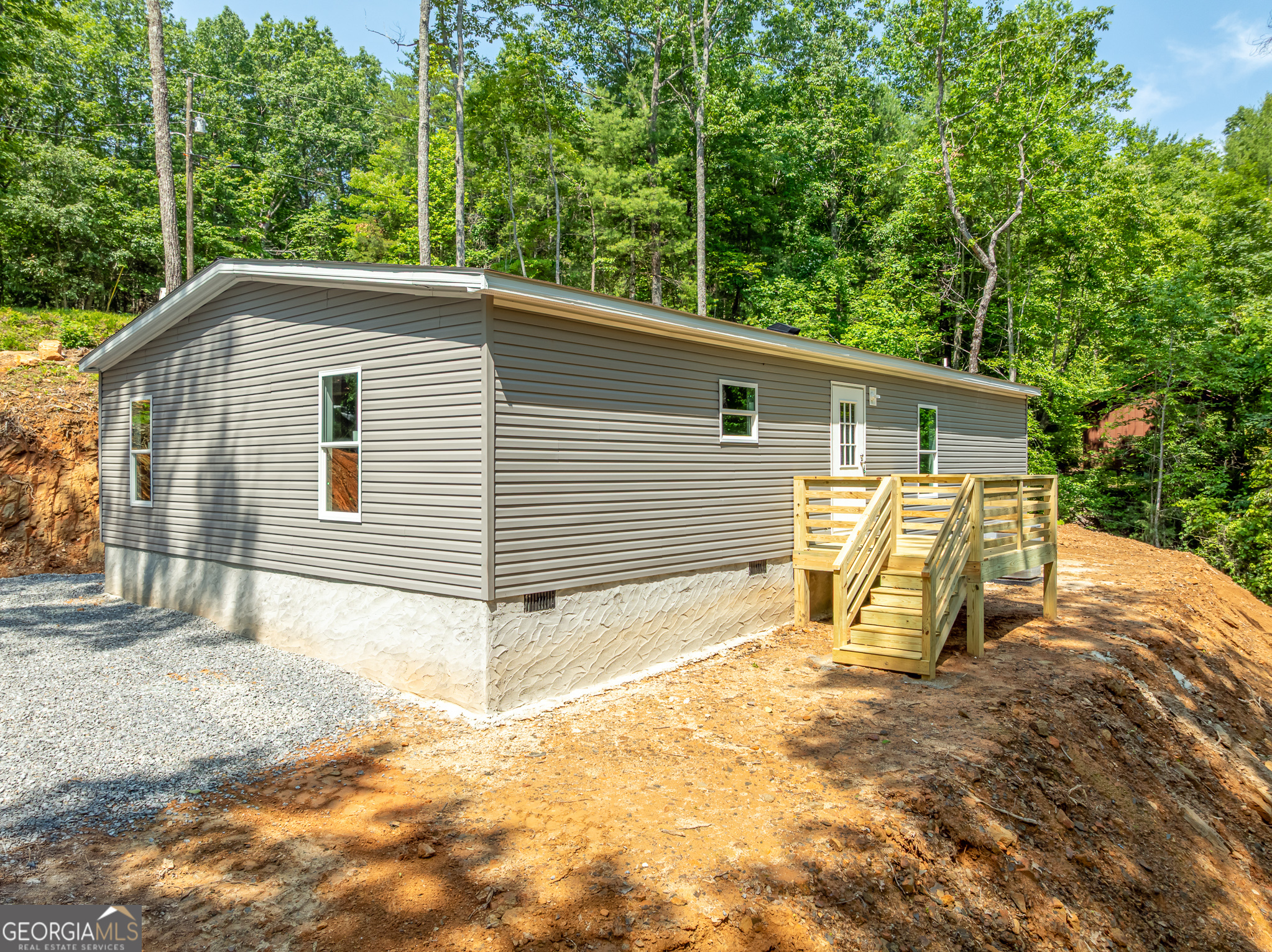 134 Double Line Road Ellijay, GA 30540 - Photo 2 of 33 a view of a backyard with a large tree