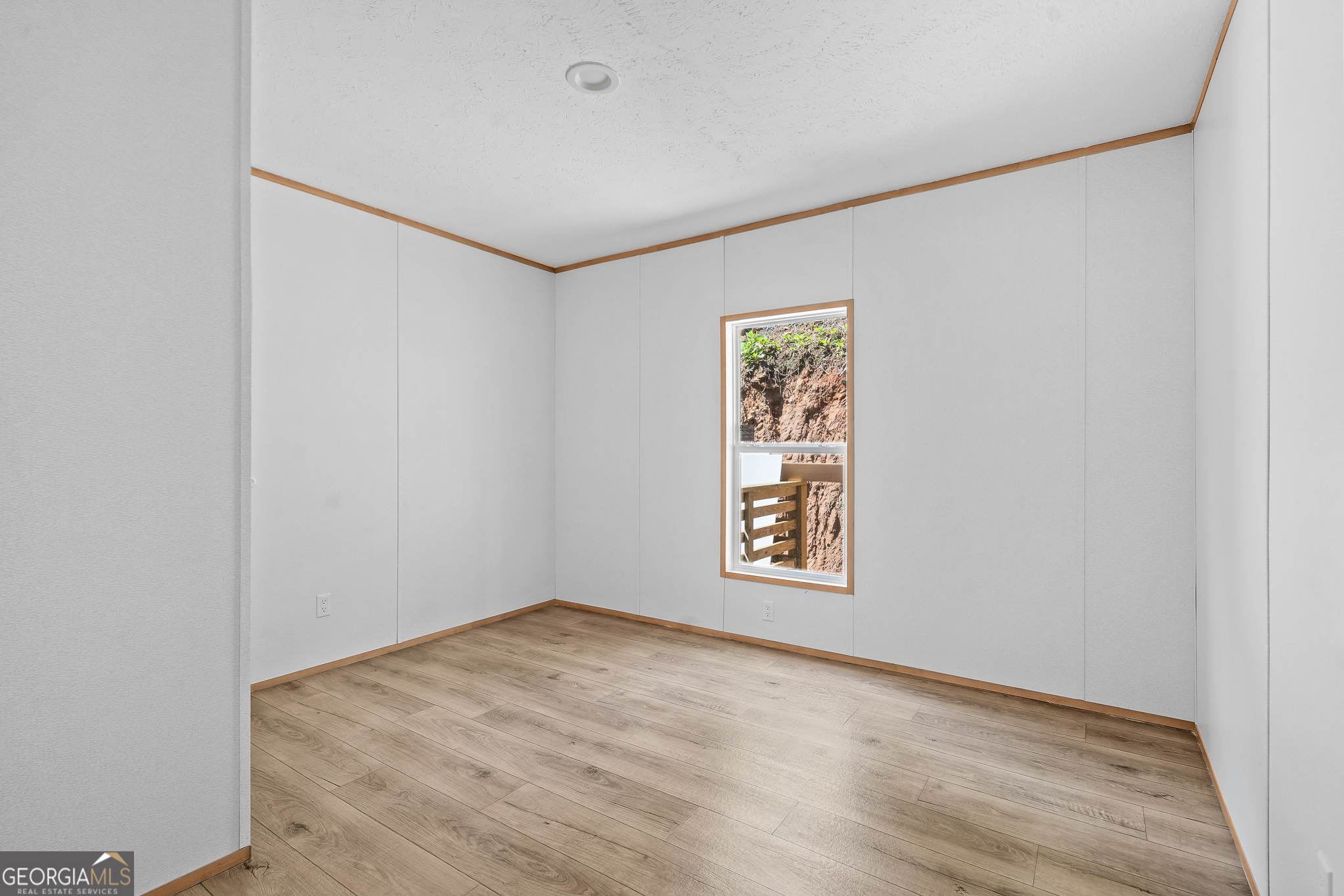 134 Double Line Road Ellijay, GA 30540 - Photo 22 of 33 an empty room with windows and closet