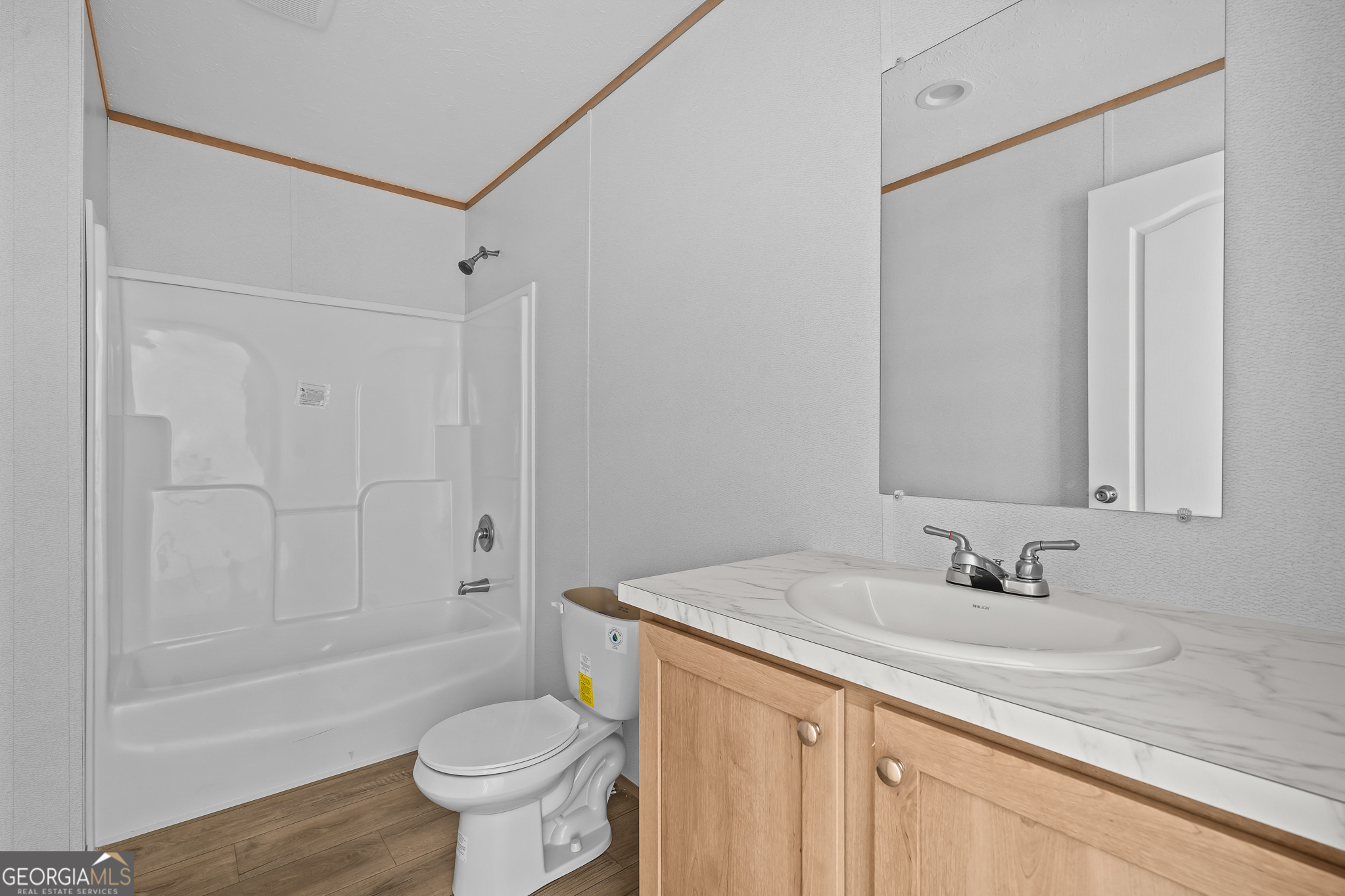 134 Double Line Road Ellijay, GA 30540 - Photo 24 of 33 a bathroom with a granite countertop sink toilet and shower