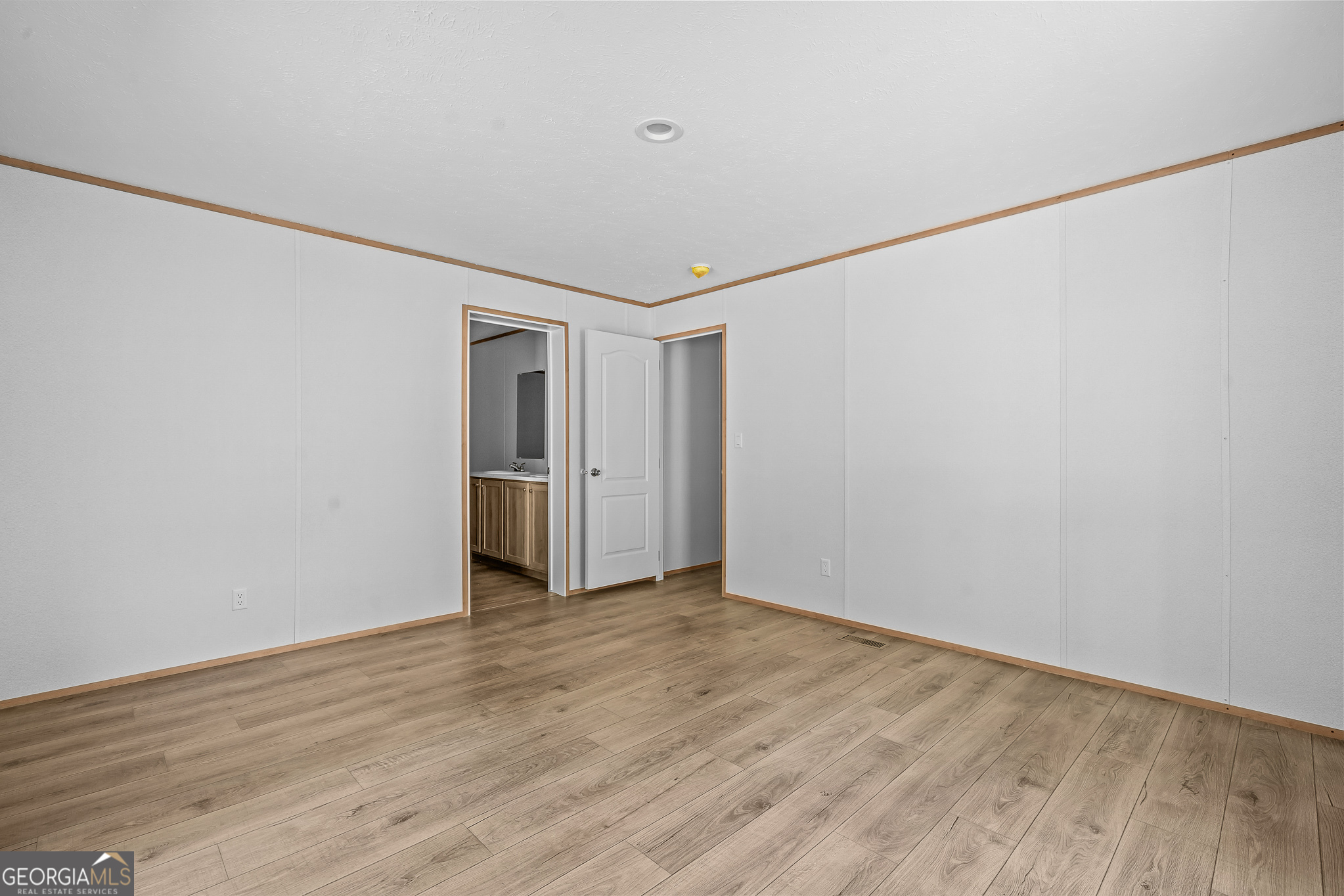 134 Double Line Road Ellijay, GA 30540 - Photo 26 of 33 a view of an empty room with wooden floor and a window