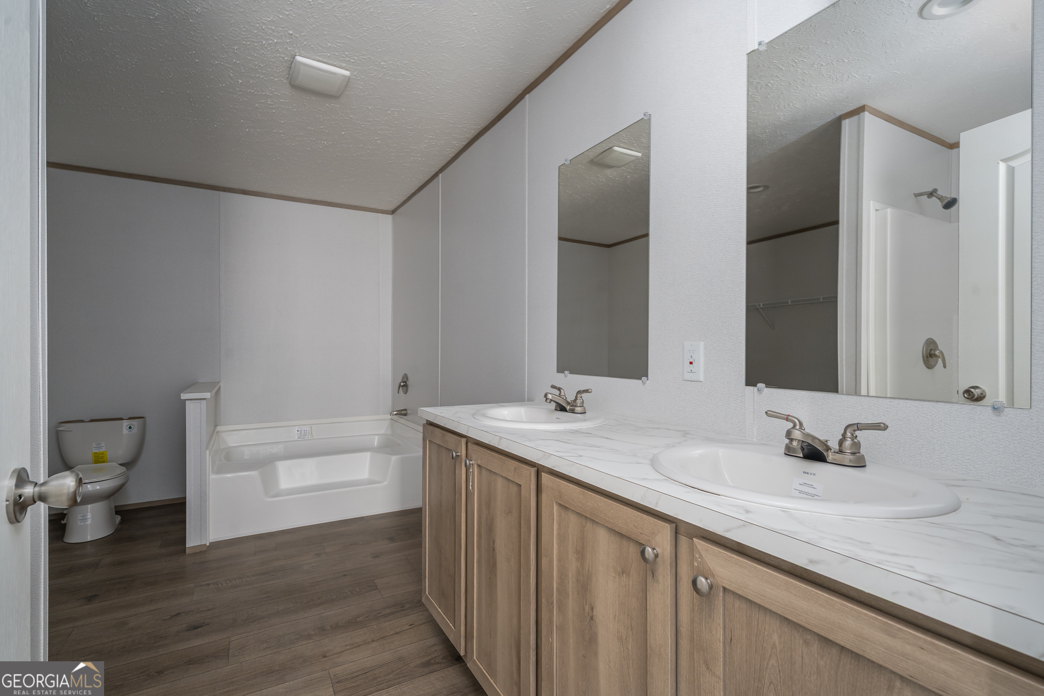 134 Double Line Road Ellijay, GA 30540 - Photo 27 of 33 a bathroom with a sink and a mirror