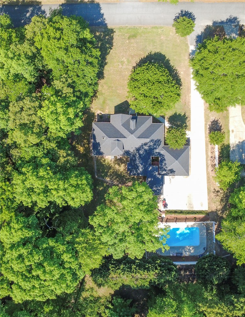 151 Hannah Circle Anderson, SC 29621 - Photo 46 of 46 An aerial perspective reveals a private residence nestled among lush trees, featuring a sparkling pool.