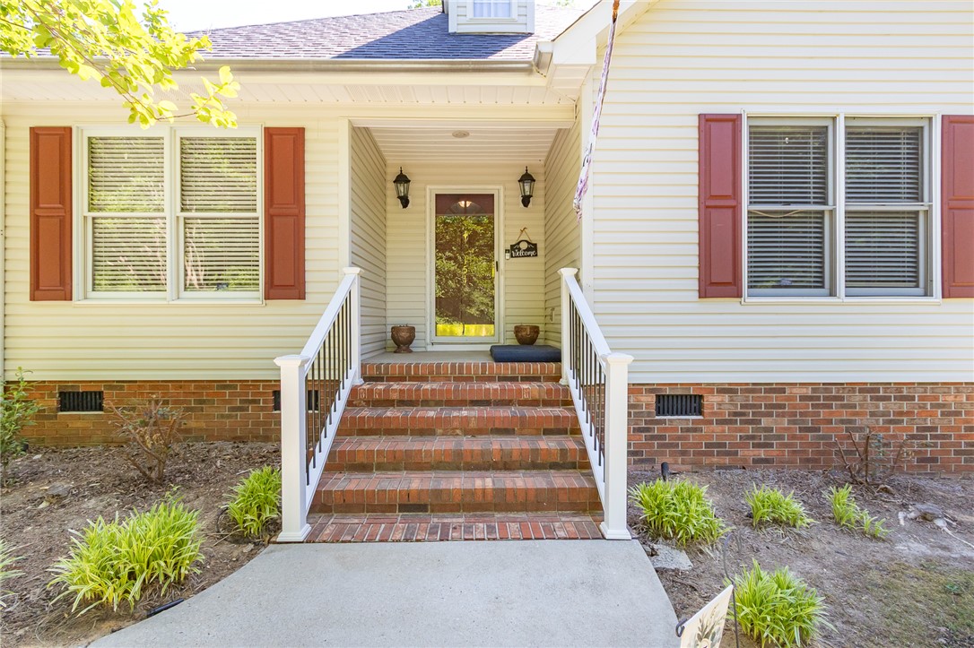 151 Hannah Circle Anderson, SC 29621 - Photo 5 of 46 This charming residence presents a welcoming entrance with brick stairs and a neatly landscaped front.