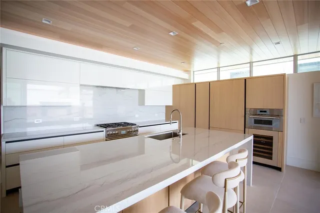 a kitchen with stainless steel appliances a stove and a refrigerator